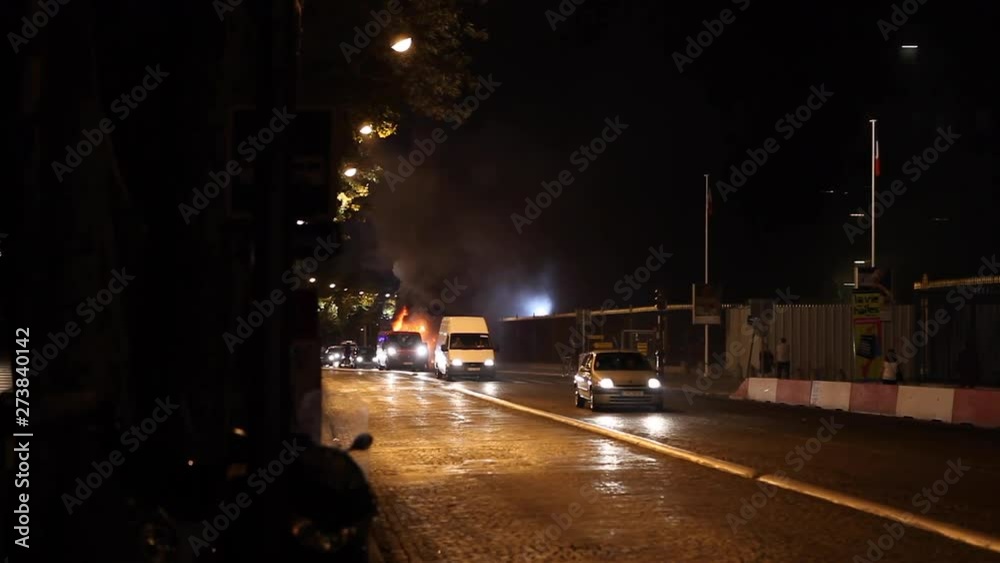 Paris, France - April 6, 2019: Fire in Paris with cars and firemens near Museum. Firefighter, Dark Smoke, burning fire, monument.