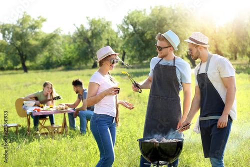 Friends cooking tasty food ...