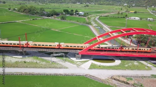 Train pass through a red steel arch bridge, Yuli, Hualien, Taiwan