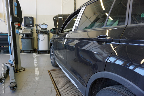 Diagnostics and repair of a modern car at the official dealer station.