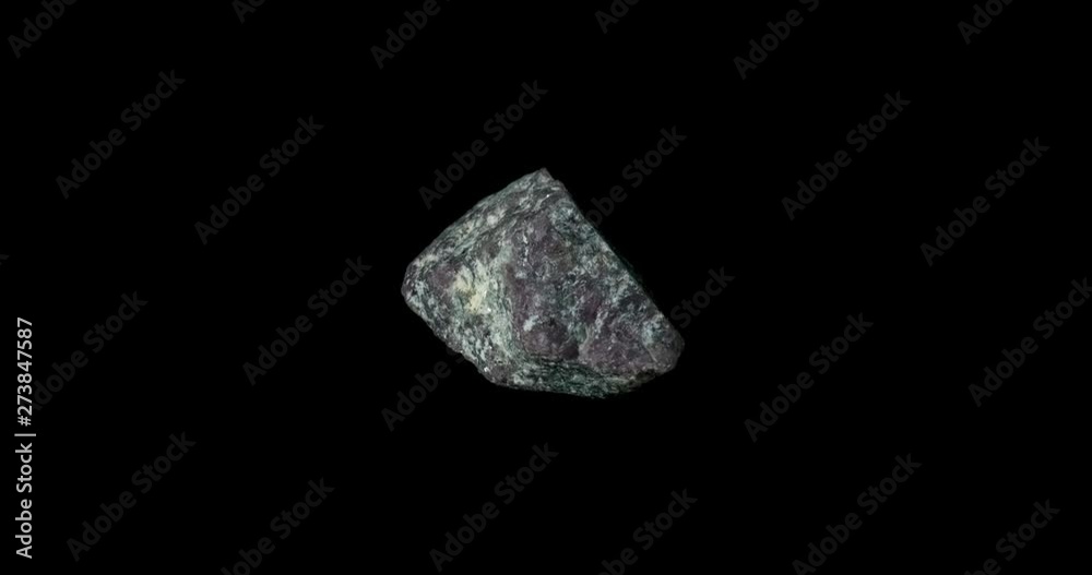 Purple Ruby Mineral Turning on Black Purple Ruby Mineral Turning on Black