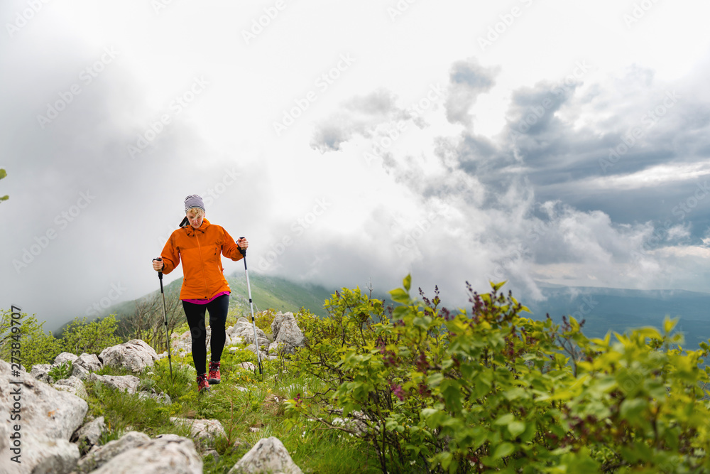 Woman Hiking alone in the mountains