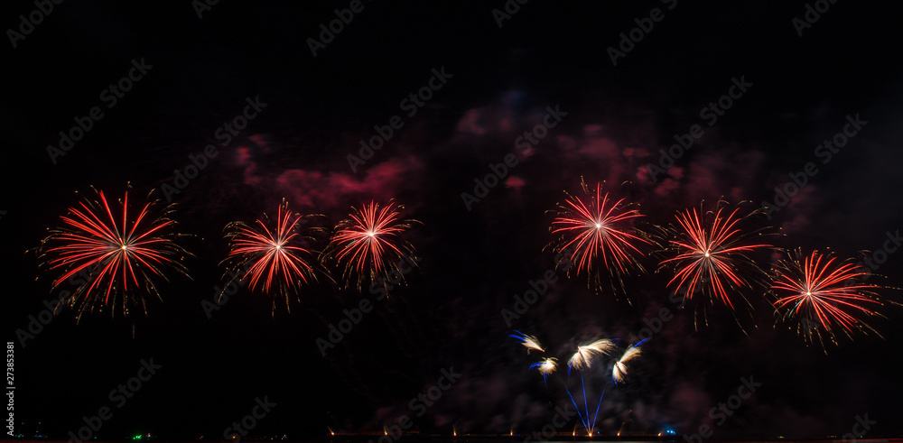 Beautiful firework display for celebration over the sea Beautiful firework display for celebration over the sea