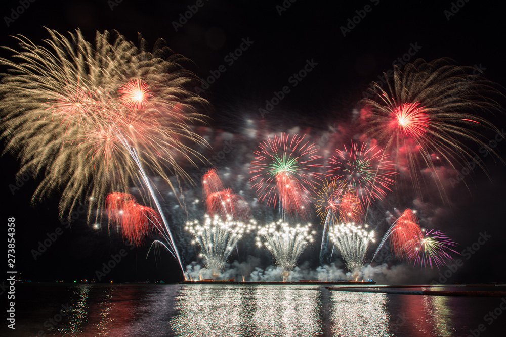 Fototapeta premium Beautiful firework display for celebration over the sea