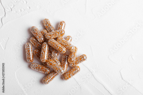 Close up vitamins and supplements on white background