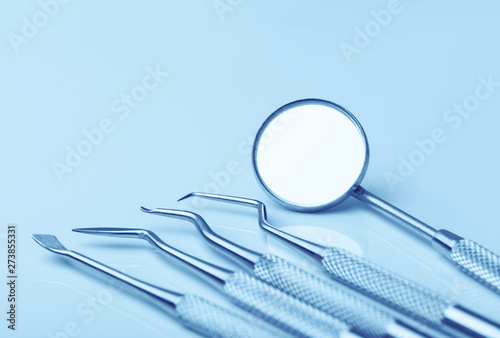 dental tools on blue background top view