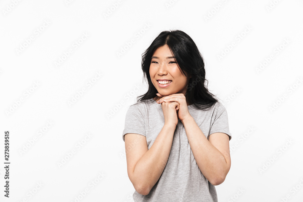 Asian beautiful young woman posing isolated over white wall background. Asian beautiful young woman posing isolated over white wall background.