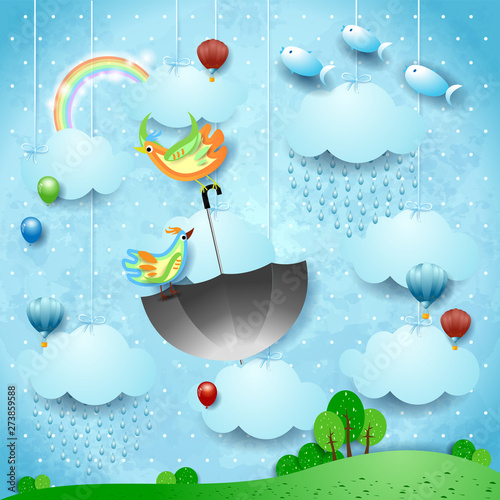 Surreal landscape with rain, flying umbrella and fishes