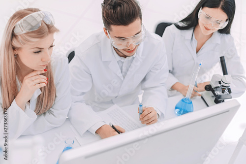 top view.a group of scientists working on a computer in the laboratory