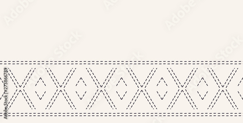 Decorative running stitch embroidery border. Victorian diamond needlework pattern. Hand drawn ornamental textile ribbon. Ecru cream home decor edging. Monochrome chevron seamless vector background. photo