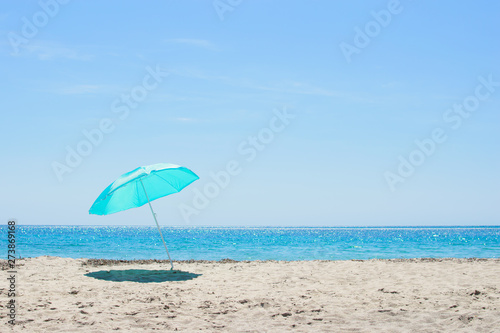 Sun umbrella on the sandy beach.