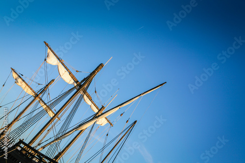 Tall pirate sailing ship in the Caribbean with blue sky