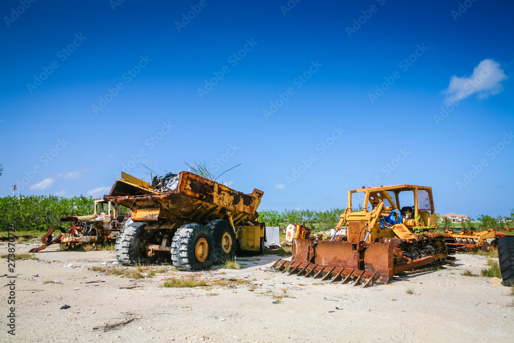 Broken down abandoned and rusting construction vehicles - industry downturn Broken down abandoned and rusting construction vehicles - industry downturn