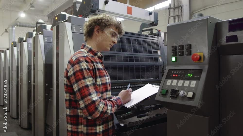 Industrial Worker - Quality Control, controlling and writing the result of the quality of printing process. Modern Printing house.