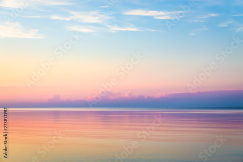 Seascape with colorful evening sky. Natural background. Beautiful sunset over the sea in the Atlantic ocean. © udovichenko