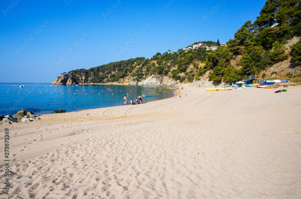Costa Brava beach. Blue clean water and beautiful beach. Turquoise bay with a crystal water. Summer vacation. Nature in Spain 