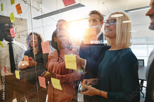 Diverse businesspeople laug...