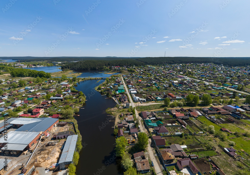 Sysert city. River and houses. Aerial. Summer day