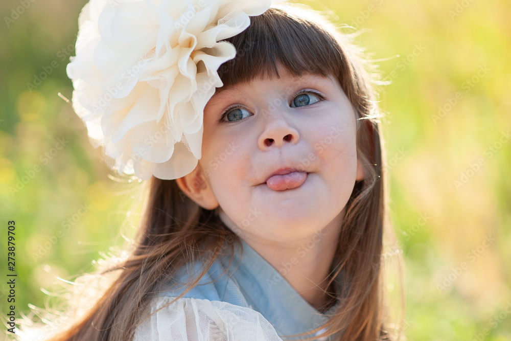 Portrait of a little girl in the park on nature Portrait of a little girl in the park on nature
