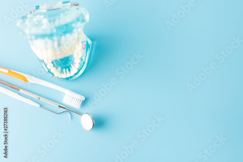 Dental tool with model in dental care concept.