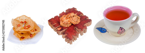 Tea cup , rempeyek and honey corn flake cookies  on white background