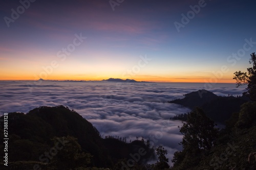 A stunning colorful mountain sunset or sunrise on campsite 7 mount Raung. Raung is the most challenging of all Java’s mountain trails, and the most active volcanoes on the island of Java Indonesia.