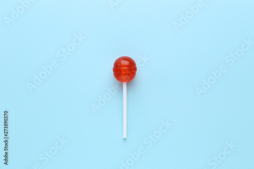 Sweet lollipop on blue background