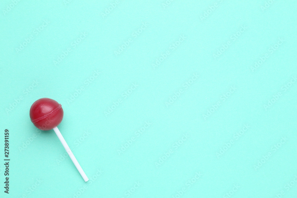 Sweet lollipop on mint background Sweet lollipop on mint background
