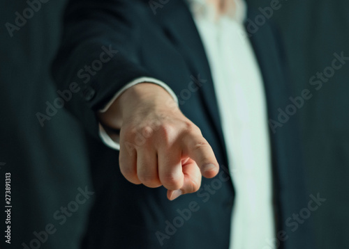 Close up of a businessman hand pointing at camera