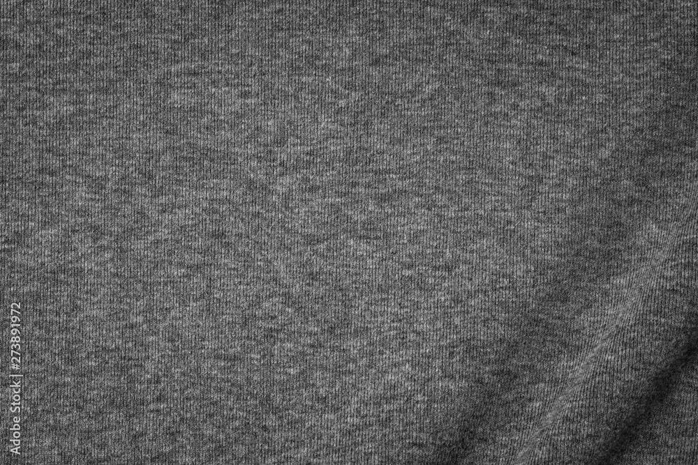 Grey cotton texture background. Detail of sweater fabric surface. Grey cotton texture background. Detail of sweater fabric surface.