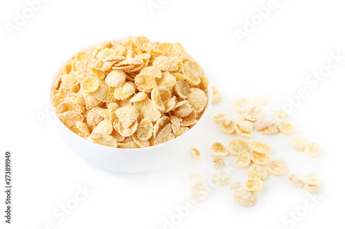 Corn flakes in bowl on white background