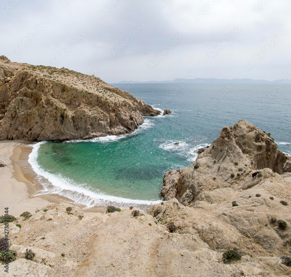 Small rocky bay with fine sand on the island of Samothraki in Greece Small rocky bay with fine sand on the island of Samothraki in Greece