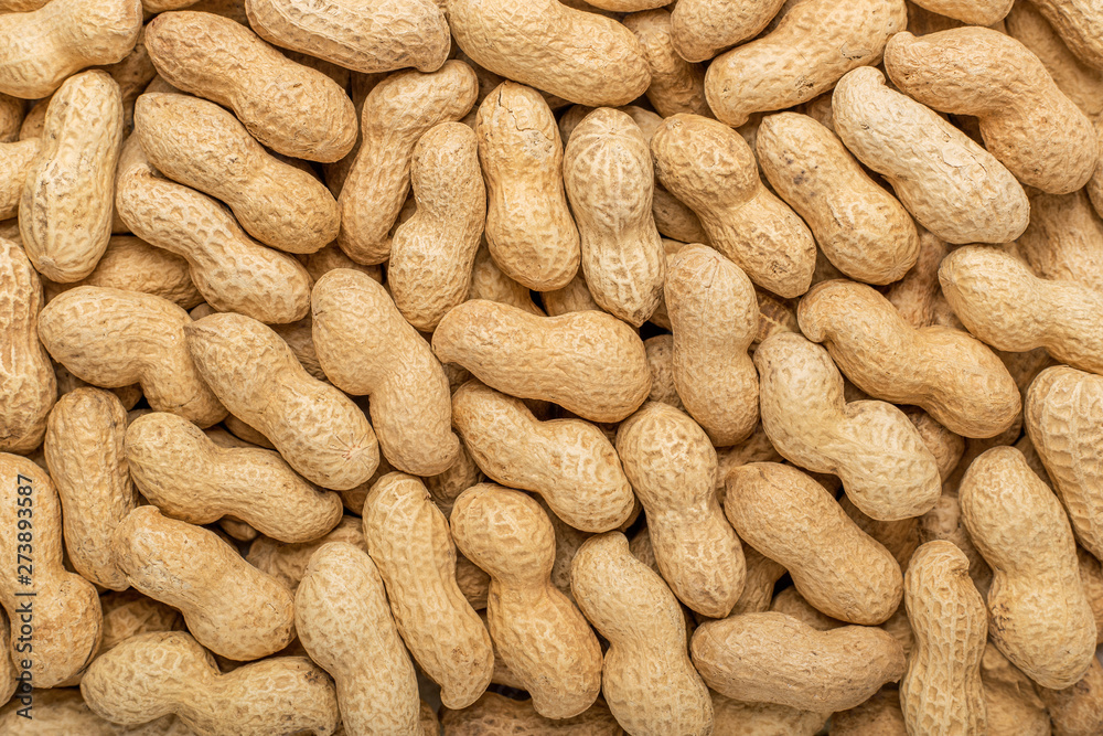 Peanuts in the shell. Texture for designers. Food. Background of