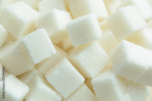 pieces of crystalline sugar in bulk. concept - sugar is white death