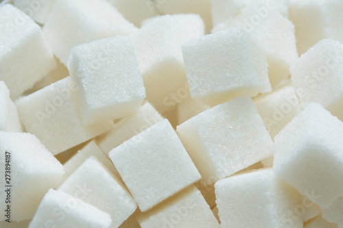 pieces of crystalline sugar in bulk. concept - sugar is white death