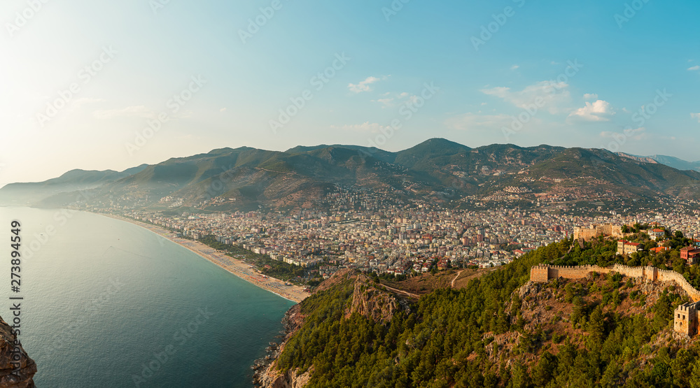 Panorama of the old town overlooking the beach. View of the resort town. Alanya is popular tourist destination in Turkey. Panorama in high resolution observed from Fortress of Alanya