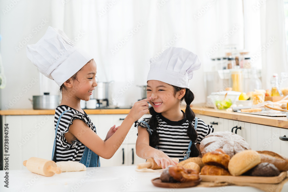 kids happy and fun are preparing the dough, make bread in the kitchen kids happy and fun are preparing the dough, make bread in the kitchen