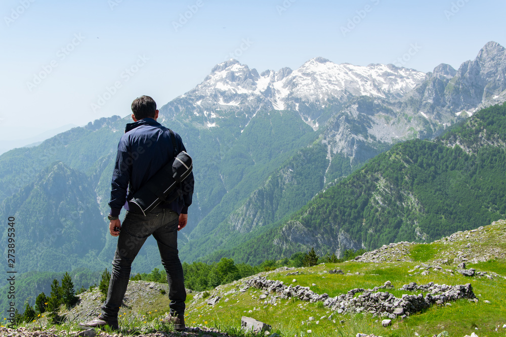 Adult sporty man in the mountain. Traveller, explorer, freedom concept