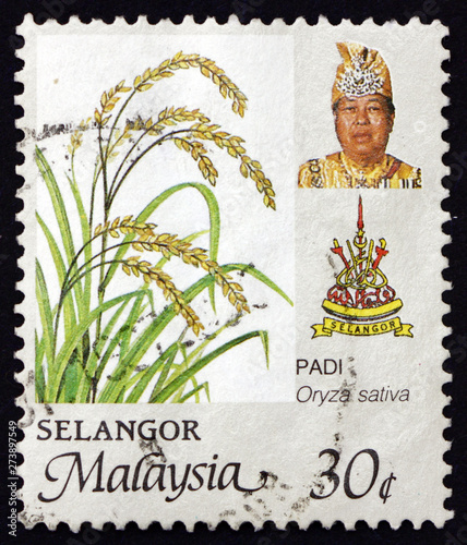 Postage stamp Malaysia 1986 shows rice, state arms and Sultan Salahuddin photo