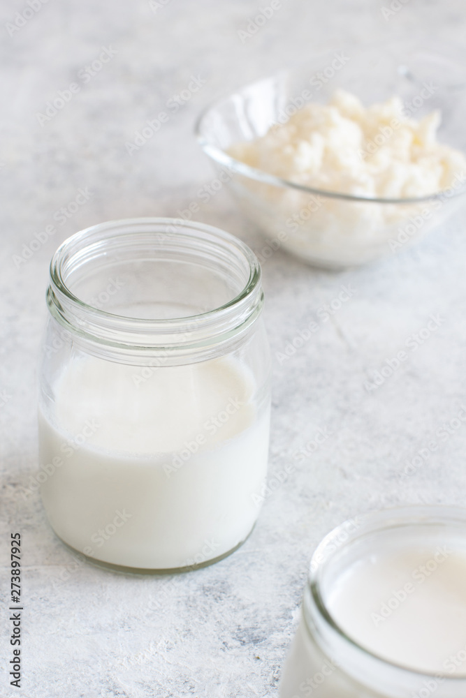 Fermented drink kefir in small bottles and kefir grains Fermented drink kefir in small bottles and kefir grains