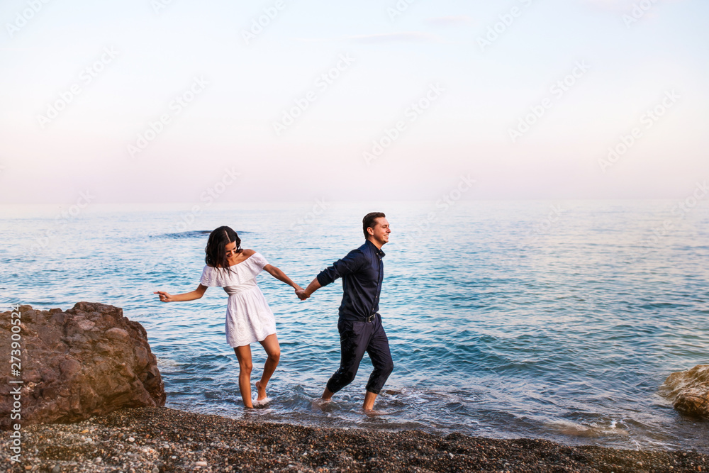 Romantic couple in the sea water have fun together. Romantic couple in the sea water have fun together.