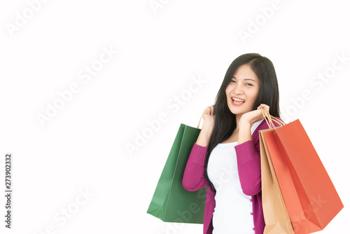 Asian beautiful woman smiles happily with shopping Beautiful woman carrying shopping bags on a white background.