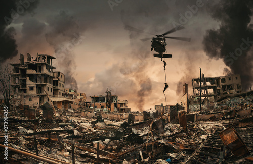 Canvas Print Military Forces between smoke and ruins roping to destroyed city