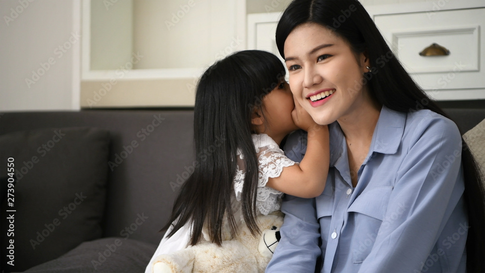 Family concept. The daughter is telling the secret to her mother. Family concept. The daughter is telling the secret to her mother.