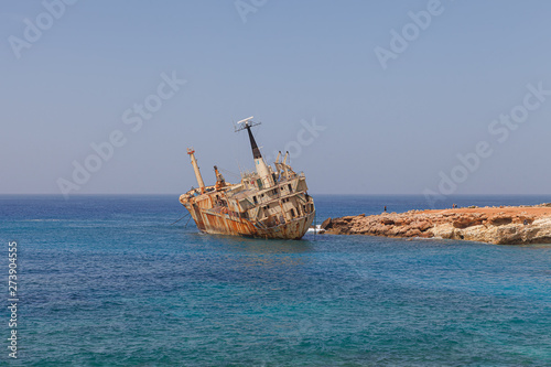 CYPRUS - MARCH, 30, 2018: Rusty abandoned ship Edro III near Paphos beach. The most attractive shipwreck of Cyprus island. Sunny summer day. © yegorov_nick
