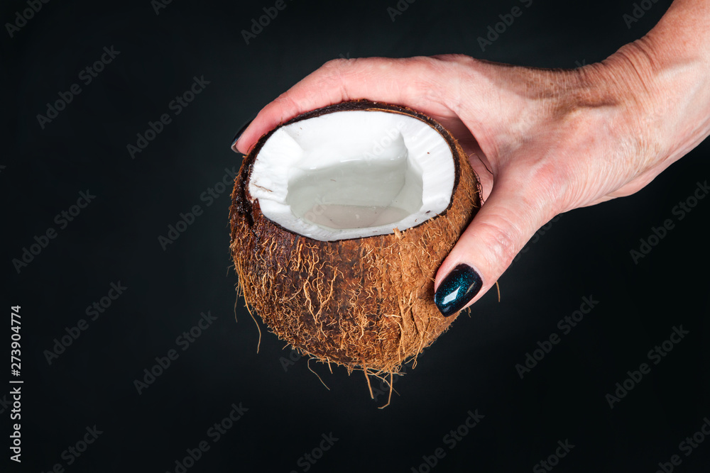 Fototapeta premium tropical coconut on a black background