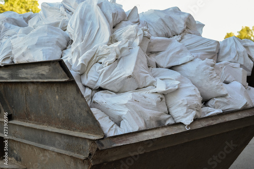 Garbage bags. Group of white Plastic Bags Filled with Trash. waste management in large cities. Ecology, garbage disposal, environmental protection, production.