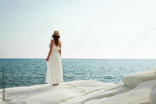 Unrecognizable young woman watching the sea view