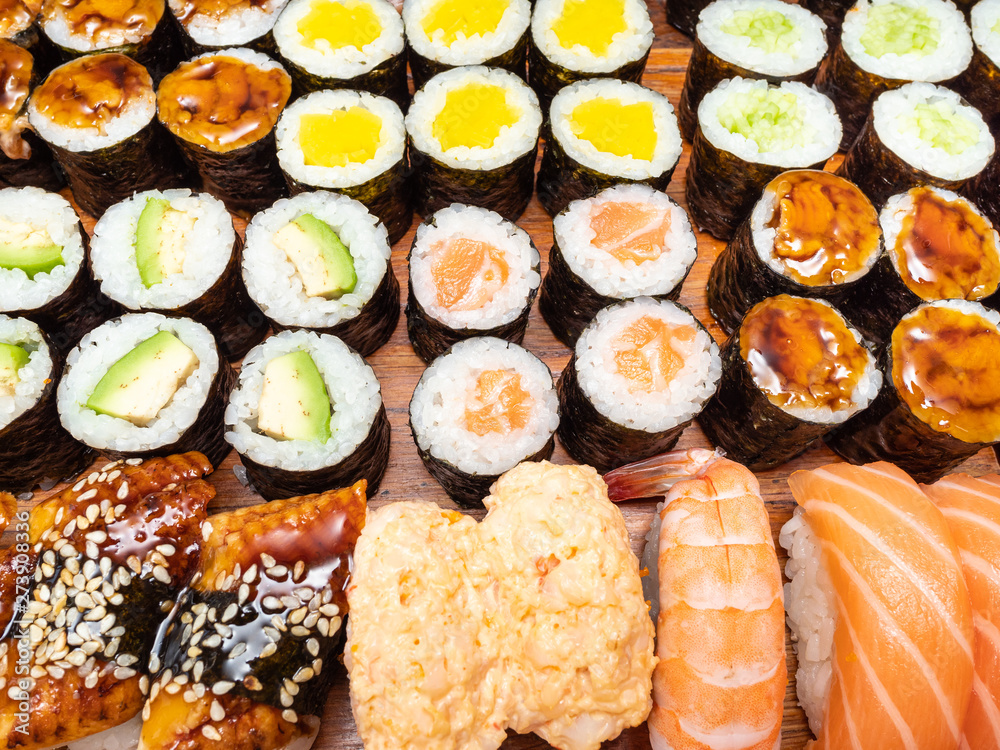 above view of many of sushi and rolls above view of many of sushi and rolls