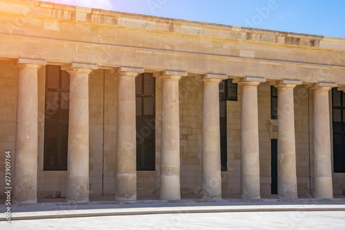 A series of columns under the roof of the building.